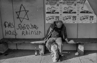 Germany, Berlin, 18 October 1991, a homeless man in a bus shelter in Marzahn, The Jewish house