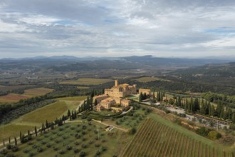 Montalcino, Italy, 16 November, 2023: aerial view of the Poggio alle Mura Castle and Villa Banfi