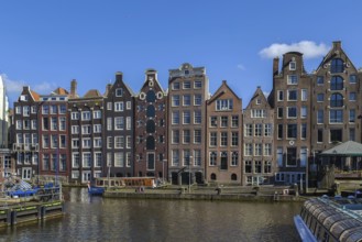 The so-called dancing house on the canal Damrak in Amsterdam