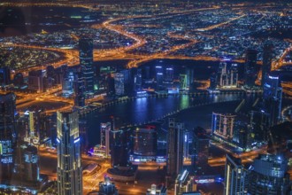 Dubai night view seen from the observation deck of Burj Khalifa. Shooting Location: Dubai