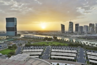 Aerial view of buildings and streets of Doha, Qatar during sunset. HDR image