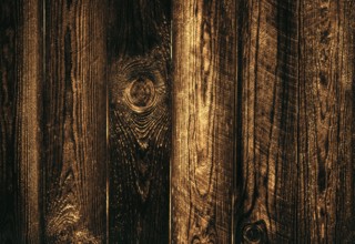 Wooden dark texture of boards close-up