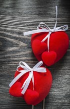 Red Valentine hearts on wooden board celebrations concept