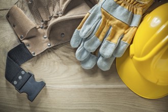 Leather tool belt protective gloves hard hat top view