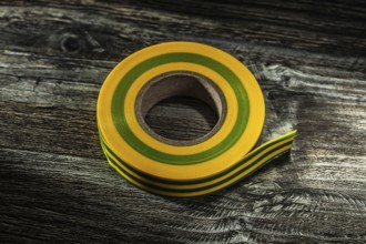 Rolled duct tape on vintage wooden board