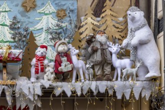Brown half-timbered building decorated for Christmas with Father Christmas, Tedi bear and deer