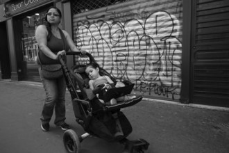 Woman pushing pram, paris streets, france, europe?