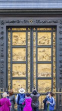 People at the Gates of Paradise at the Baptistery of St. John in Florence, Italy, Europe