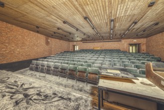 Dilapidated lecture theatre, its floor covered with rubble and dust, Institute of Molecular