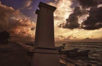Puerto Morelos sunset lighthouse in Mayan Riviera Maya of Mexico