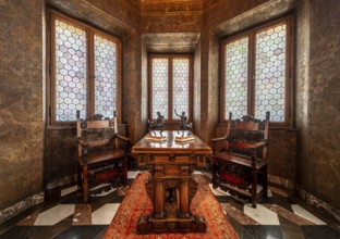 Krakow, Poland, March 23, 2024, Interior of a bowed window with stained glass, luxury chairs and a