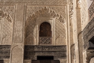Fes, Morocco, April 05, 2023, Traditional oriental facade at the courtyard of madrasa Bou Inaniya