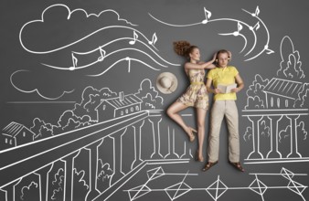 Love story concept of a romantic couple with different interests on holiday against chalk drawings