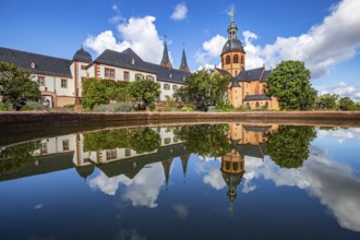 A historic monastery in the morning. Monastery walls, church and buildings are reflected in the