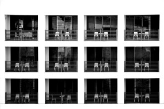The exterior façade of a modern hotel with recessed balconies