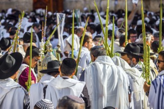Jerusalem, Israel. Jews praying at the Western Wall wrapped in white Talit. Blessing of the Cohenim