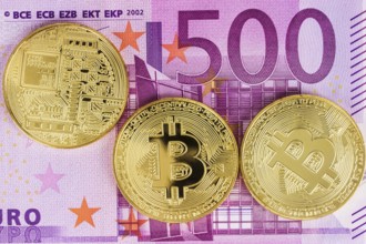 Bitcoin coin on euro banknotes as background