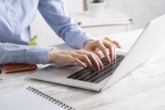 Office manager working with laptop. Corporate office workplace with computer. Business occupation