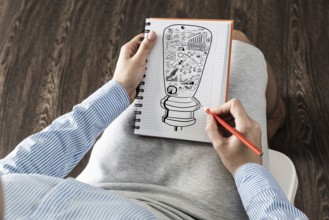 Close-up, woman draws business notes in her notebook. Business Innovation Concept