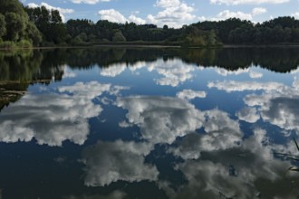 Old water with white clouds