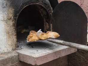 Traditional Cypriot easter pastries made with mixture of various cheese and halloumi and cooked on