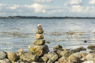 Scenic spiritual stone tower at the seashore