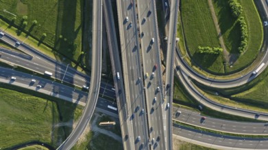 Aerial top view of lot of cars on modern road junction
