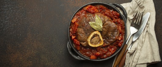 Traditional Italian dish Ossobuco all Milanese made with cut veal shank meat with vegetable tomato