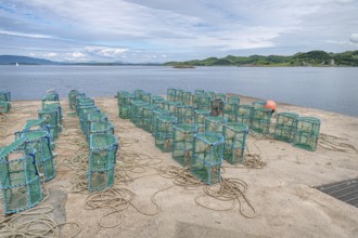 Lobster pots drying on the harbour in Crinan, Argyll and Bute, Scotland, United Kingdom, Europe