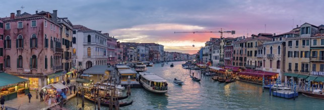 The Grand Canal with gondola and vaporetto at sunset time, Venice, Italy, Europe