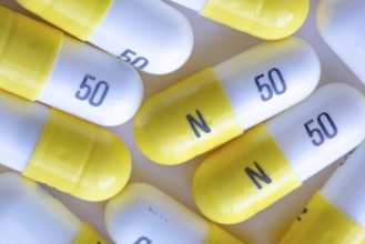 A macro close up to white and yellow N 50 capsules