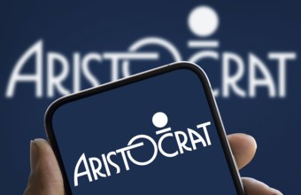 Aristocrat Leisure logo is displayed on smartphone. Aristocrat Leisure Limited is an Australian