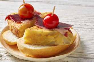 Spanish omelette with iberian ham pincho tapas from Spain food recipes