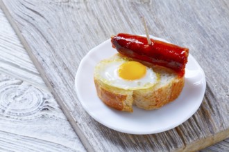 Pinchos pintxos chistorra with quail egg tapas from Spain sausage food