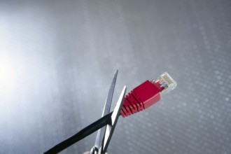 Cutting with wired technology metaphor, ethernet RJ45 cable scissors