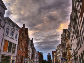 A historic old town with old buildings under a dramatically cloudy sky, Lübeck, Baltic Sea,