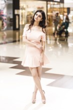 Full length portrait of a young stylish woman