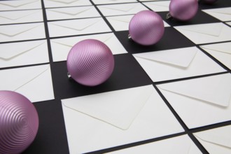 Christmas decoration with envelopes and purple balls. Christmas composition