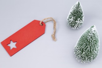 The photo shows a red Christmas sign against a grey background