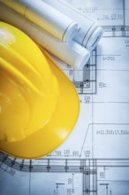 Safety building helmet construction drawings on blueprint