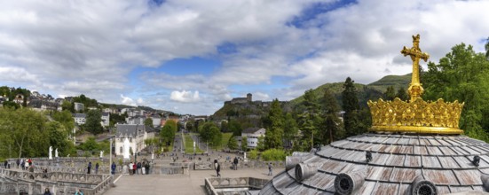 Lourdes, France, 17 April, 2024: view of the town of Lourdes with the hilltop castle and the cupola