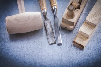Composition of joiner's tools on metallic background construction concept