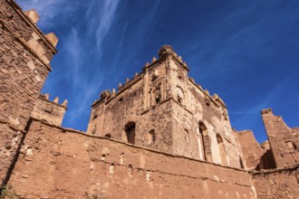 An old kasbah that served as a base for nomadic tribes, with a sense of ruggedness and adventure