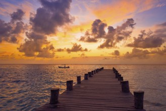 Riviera Maya pier sunrise in Caribbean Mayan Mexico