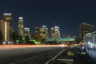 A picture of Downtown Los Angeles and the Harbor Freeway's traffic lights at night