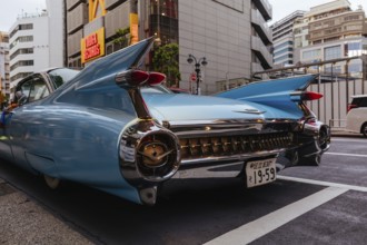 TOKYO, JAPAN, MAY 12, 2019, A classic American car near Shibuya Crossing and Tower Records, in