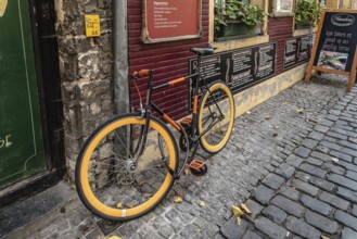 Ghent, Belgium, July 31, 2016: Picturesque restaurant with bicycles parked and flowers in Ghent,