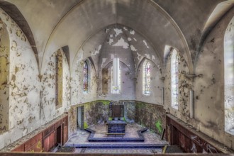 Church interior with colourfully decorated stained glass windows and an old altar, Agnus Dei, Lost