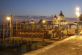 Sunset after sunset, gondola jetty, church of Santa Maria della Salute in the background, Venice,