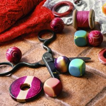 Set for needlework from thread and beads on a stone background